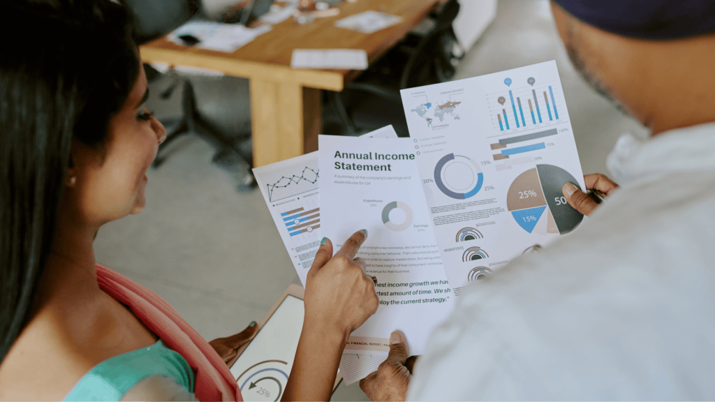 Two people reviewing franchise financial documents